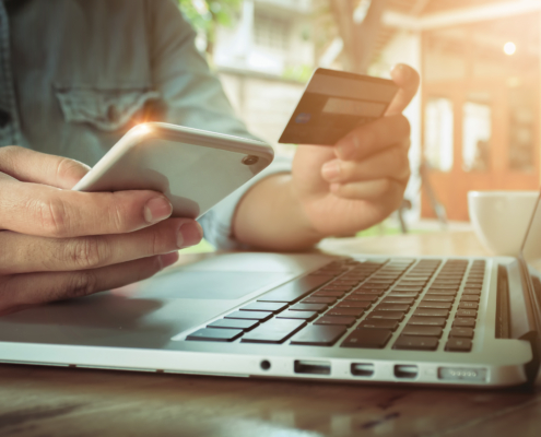 Man holding smartphone and credit card